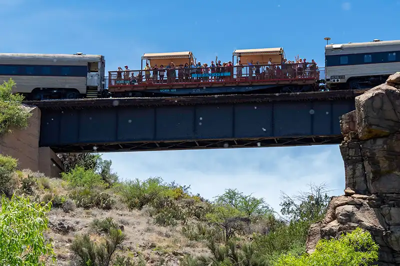 Waving Passengers Open Air Cars Verde Canyon Railroad Train Rides SOB Bridge Waving Passengers Open Air Cars Verde Canyon Railroad Train Rides SOB Bridge