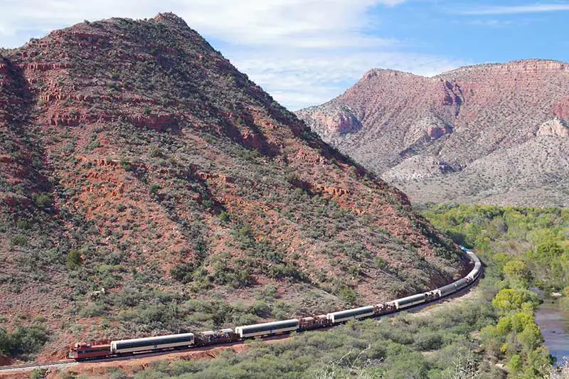 Birth of Verde Canyon Railroad Scenery with Caboose on Track Birth of Verde Canyon Railroad Scenery with Caboose on Track